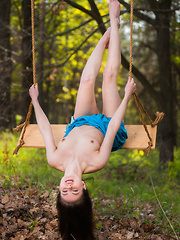 Hilary C playfully poses outdoors baring her slender body on the swing. - Pics