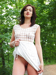Lara D strips on the grass as she bares her sweet pussy. - Pics