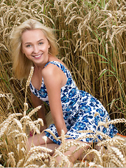 New model Bernie strips in the wheat field as she bares her delectable   body. - Pics