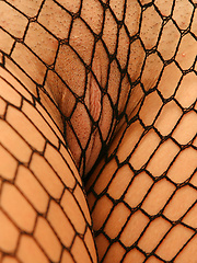 Wearing a full fishnet bodysuit Eva is letting it all hang out - Pics