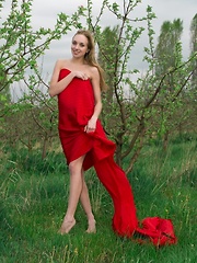 Tayra A playfully posing with a bright red fabric wrapped around her delicate, naked body - Pics