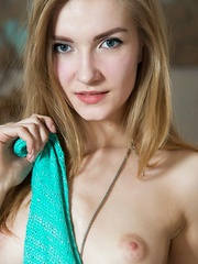 A stunning statuesque beauty Maryana is wearing turquoise lace panties and a flowy blouse - Pics