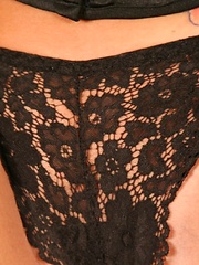 Watch as Lili Jensen slowly unbuttons her black corset and teases with her perky tits - Pics