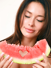 Mila M gets naughty and naked while eating a watermelon - Pics