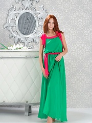 Lydia A briefly poses in her green maxi dress with hot pink belt before stipping naked and playfully posing in front of Alex Iskan\'s camera - Pics