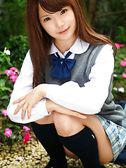 Manami Sato Asian in short uniform skirt spends time in the park - Pics