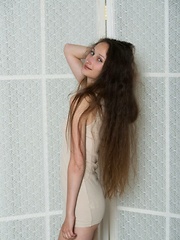 Irene's dazzling blue eyes with passion, her smile is naughty and provocative as she starts undressing her body-hugging dress, revealing her exquisite moist pussy. - Pics