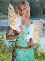 Amazing blonde teen babe gets naked on the lap of nature and tries to mimic some angelic beauty with her poses. - Pics