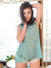 Dakota A gently caresses her fingers down her see-through, blue babydoll before she slips out of it to reveal her delightfully curvy breasts and her heavenly fuzzy pussy. - Pics